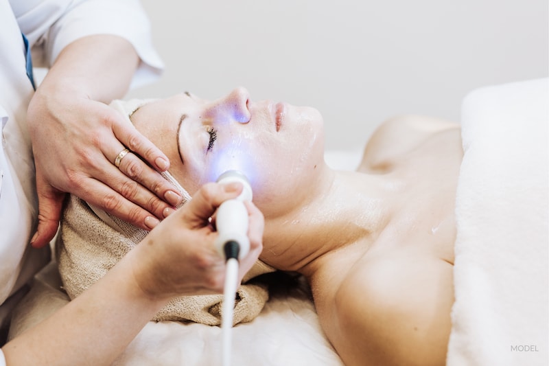 Woman getting laser treatment.